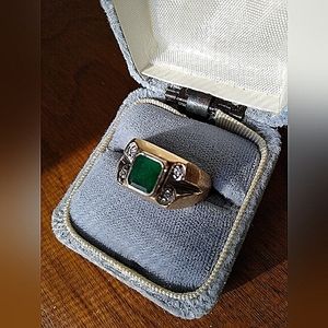 Gents 14K Gold Ring set with 1 Emerald mixed cut. Surrounded by 4-.02ct diamonds